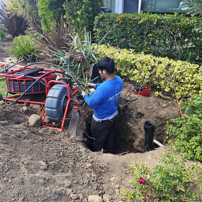 Sewer line trenchless repair with root intrusion removal