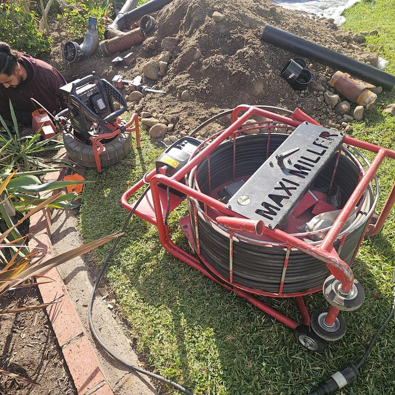 Sewer line with root intrusion and inspection equipment