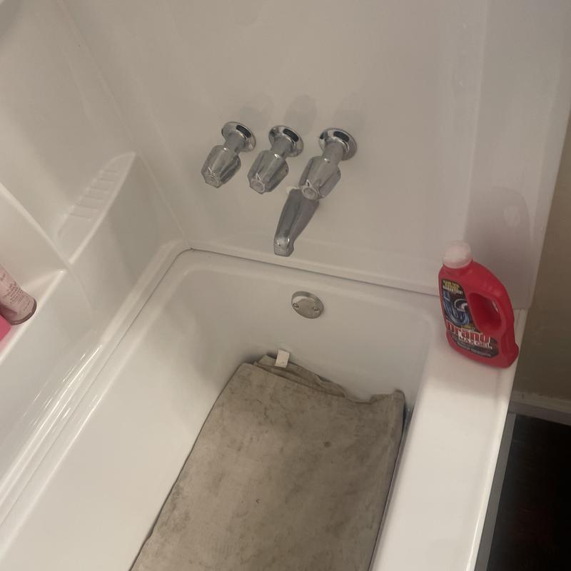 Three-handle bathtub faucet and spout installation