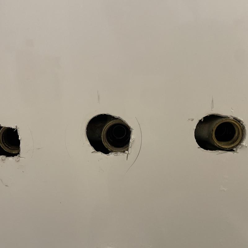 Shower valve copper piping behind wall holes