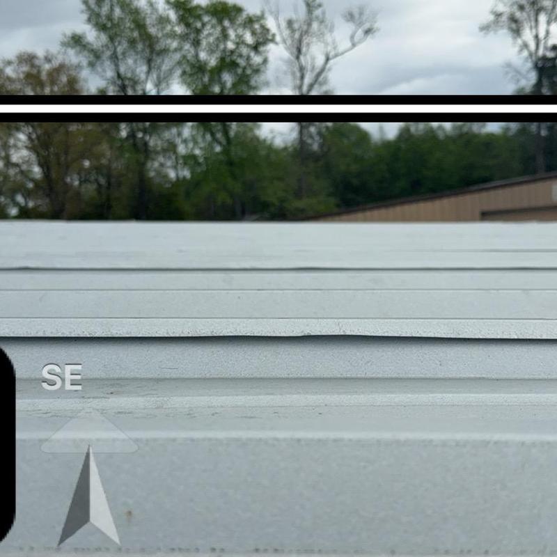 TPO metal roof retrofit with drainage upgrades