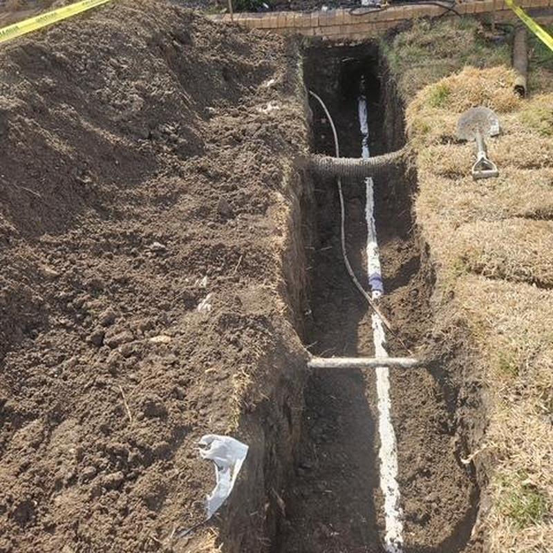Water line trench with new piping installation