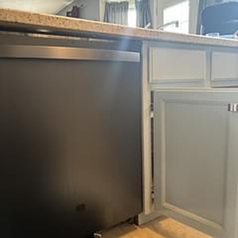 Dishwasher installation under kitchen counter with cabinets