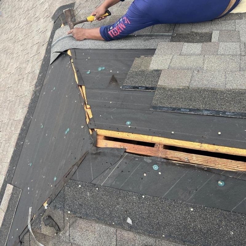 Ridge vent and shingle installation on roof repair