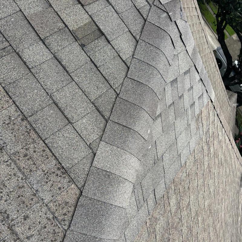 Architectural shingle roof with lifted ridge repair