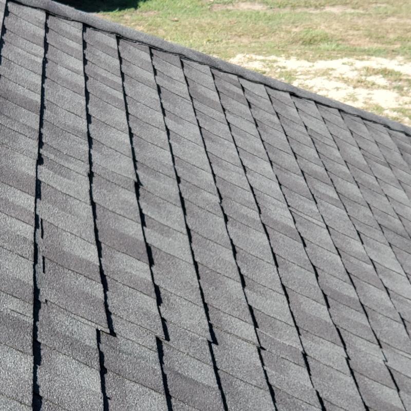 Asphalt shingle roof with wind and hail damage