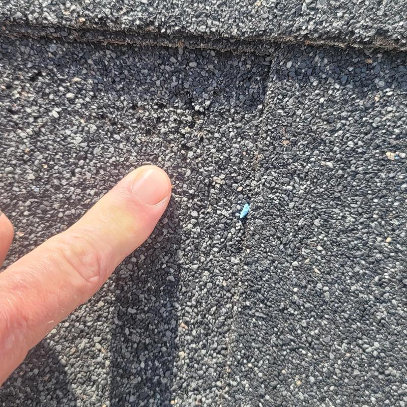 Asphalt shingle roof with hail damage granule loss