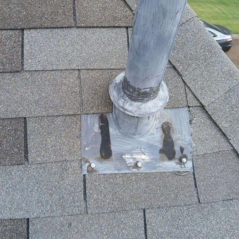 Hot water heater exhaust pipe roof flashing and shingles