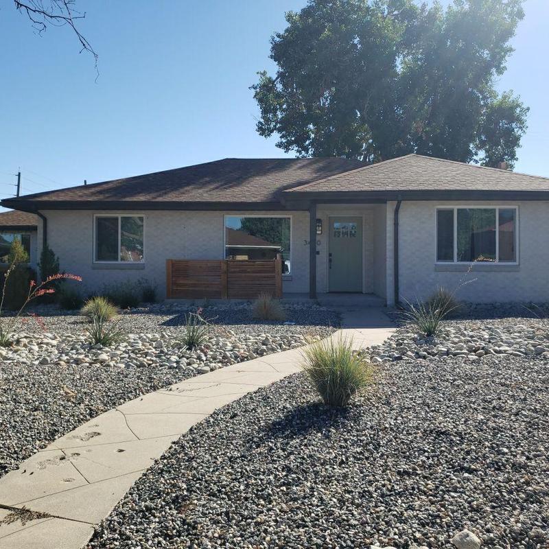 Asphalt shingle roof with repaired pipe jack and sealed nails