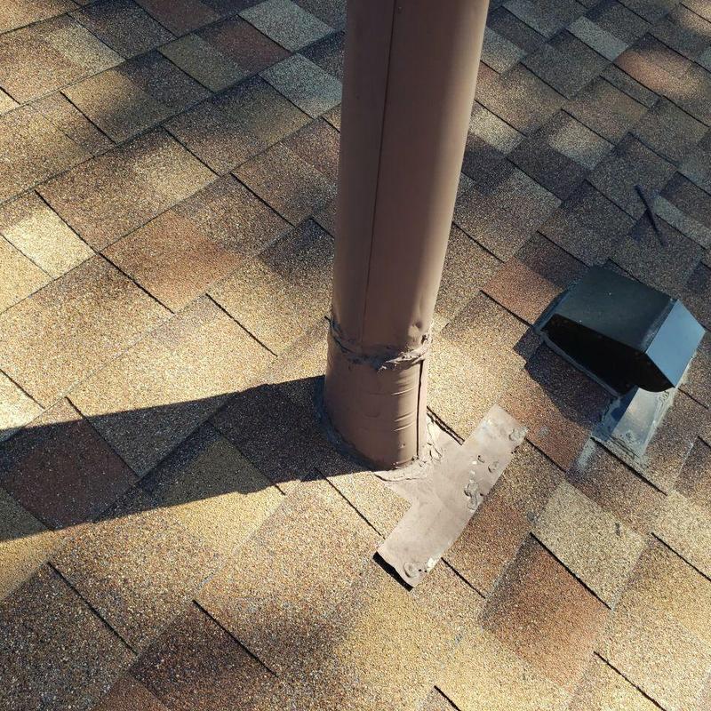 Shingle pipe jack with new storm collar seal on roof