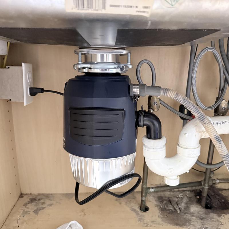 Garbage disposal installation under kitchen sink Garbage disposal installation under kitchen sink