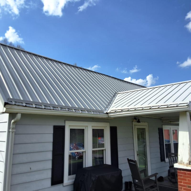 Metal roofing panels on residential home exterior