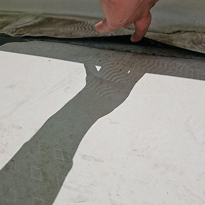 TPO flat roof with lifted seam inspection detail