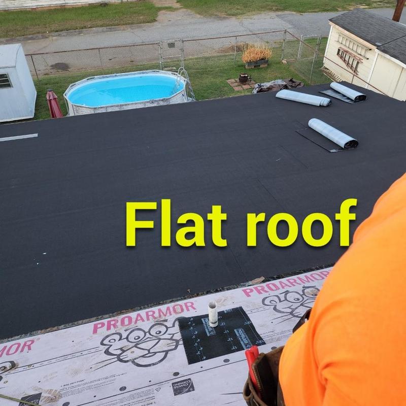 Modified bitumen flat roof installation in progress