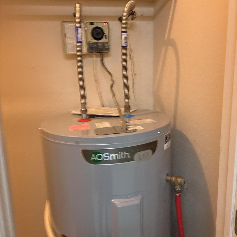 Water heater with flexible inlet and outlet piping