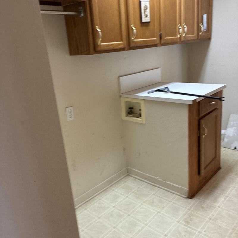 PEX pipe reroute inside kitchen cabinets with countertop