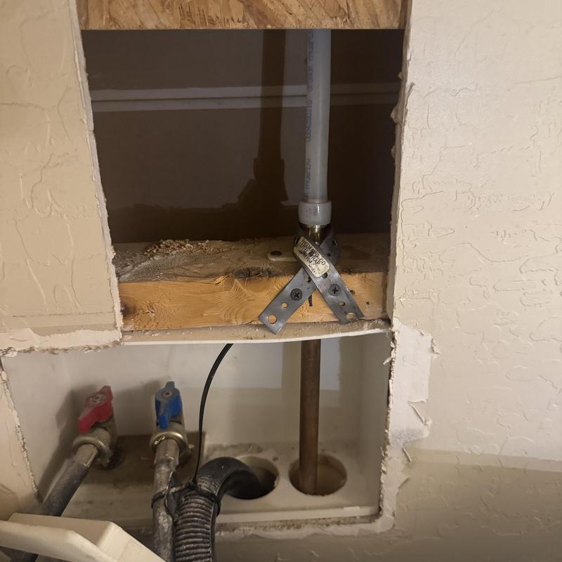 Laundry box discharge tube extension near valves and drain Laundry box discharge tube extension near valves and drain