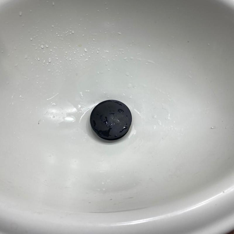 Bathroom sink drain stopper installed and adjusted