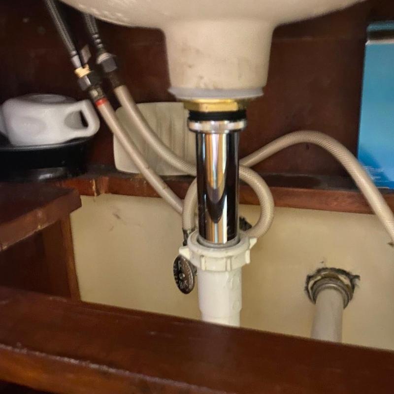 Bathroom sink drain assembly with new stopper installed