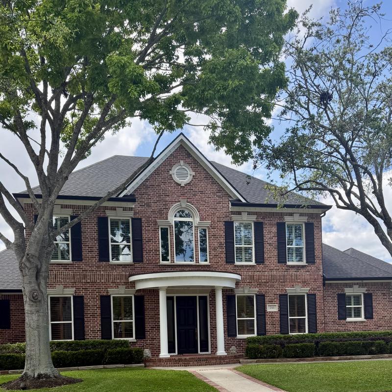 Tamko Titan XT Rustic Black roof with gutters and rain chain