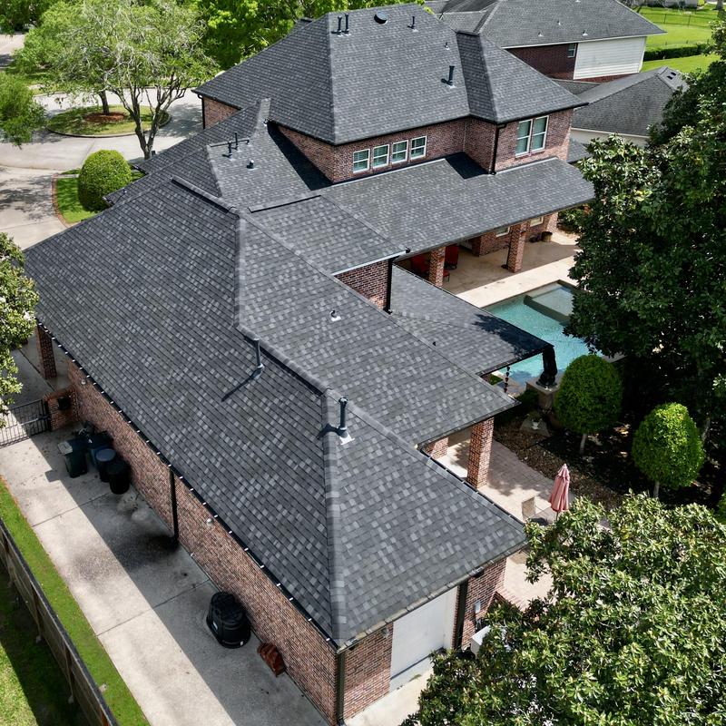 Tamko Titan XT Rustic Black roof with gutters and rain chain