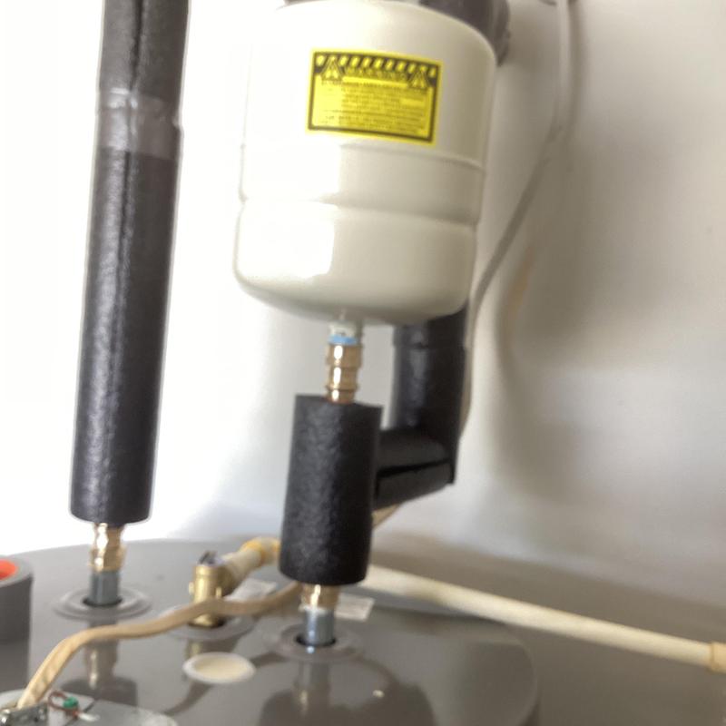 Water heater expansion tank with insulated piping