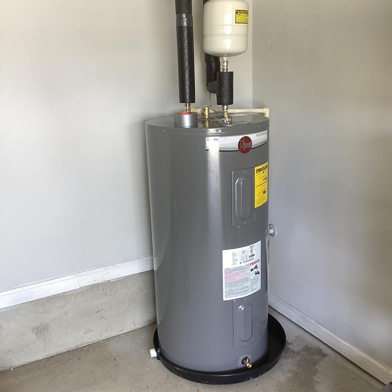 Electric water heater with expansion tank installed