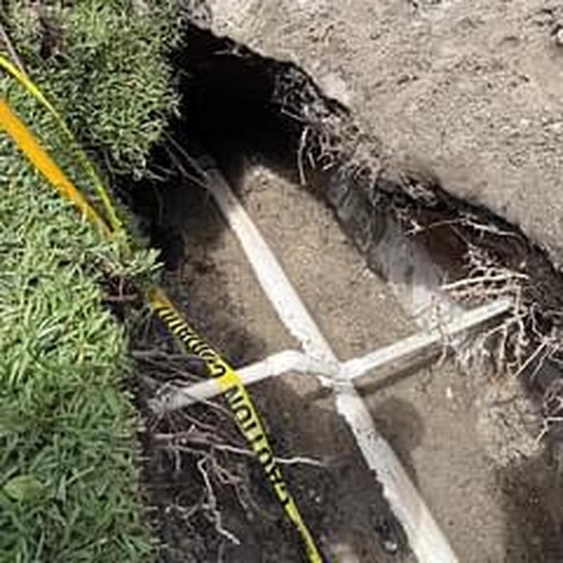 Clay sewer pipe excavation and repair with caution tape