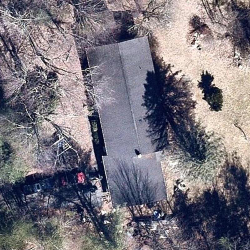 Roof shingles and flashing inspection from above Roof shingles and flashing inspection from above