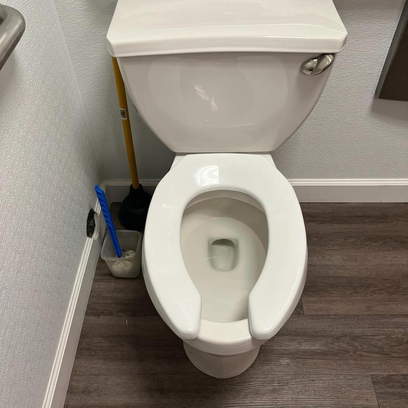 Toilet with replaced fill valve and flapper parts