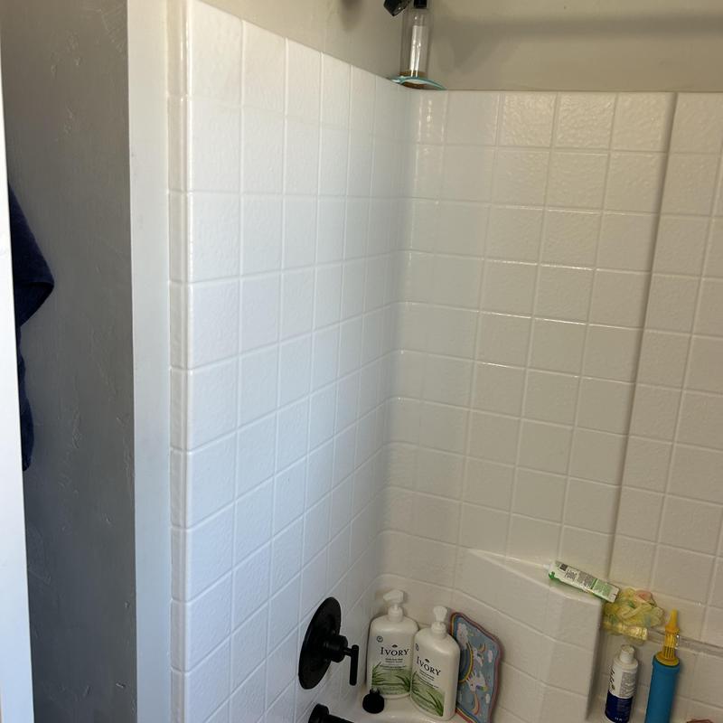 Shower valve and head in tiled shower area