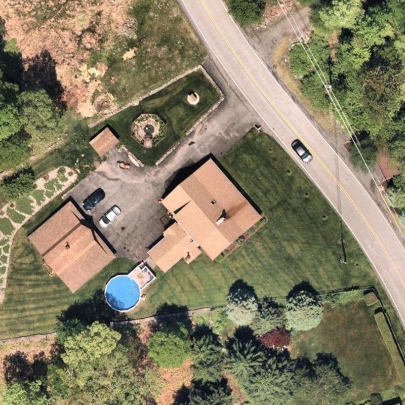 Roof and surrounding property aerial view with pool and driveway Roof and surrounding property aerial view with pool and driveway