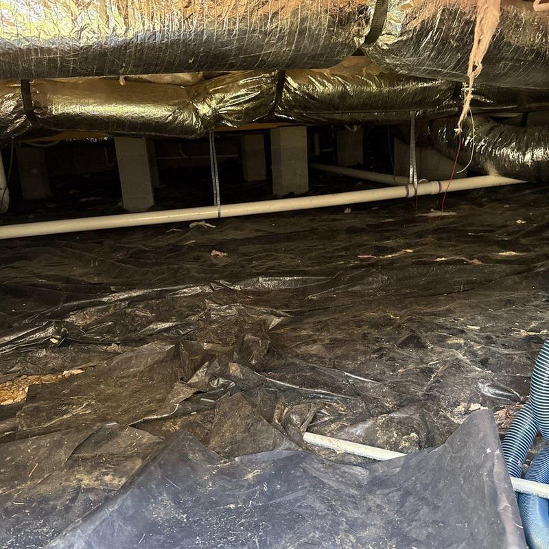 Crawl space vapor barrier installation with ductwork above