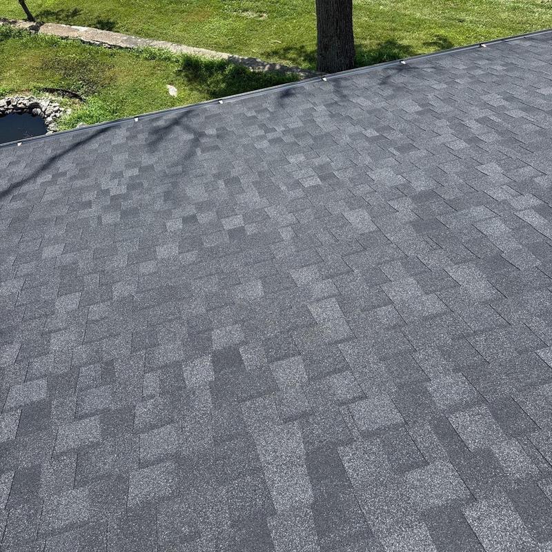 Asphalt shingle roof with hail damage inspection