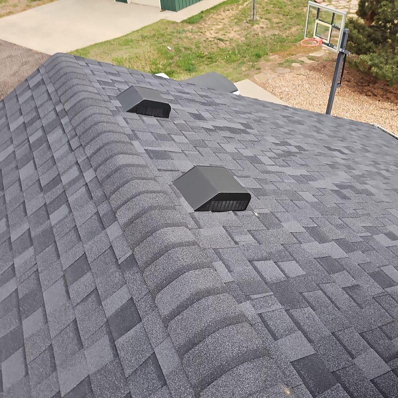 Asphalt shingle roof with vents, no hail damage visible
