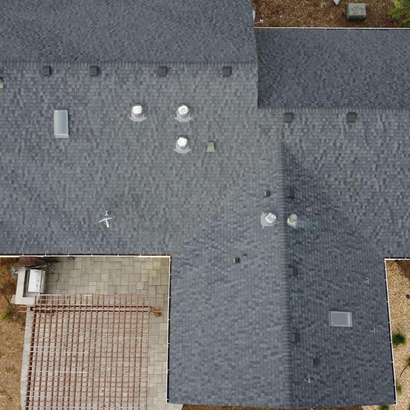 Asphalt shingle roof with vents and skylight inspection