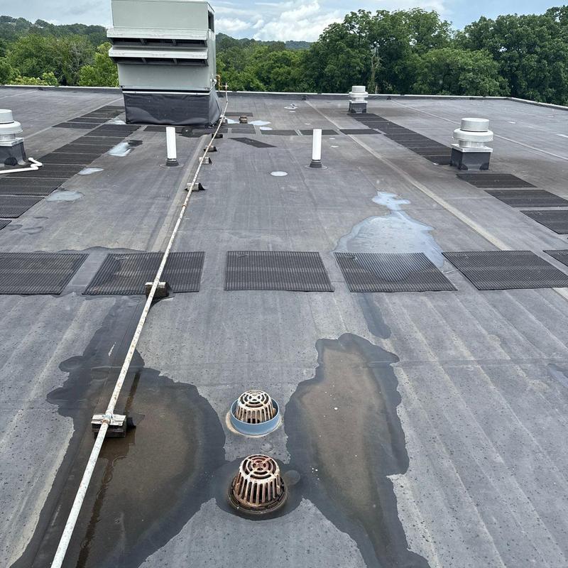 Commercial roof membrane with hail damage and wear