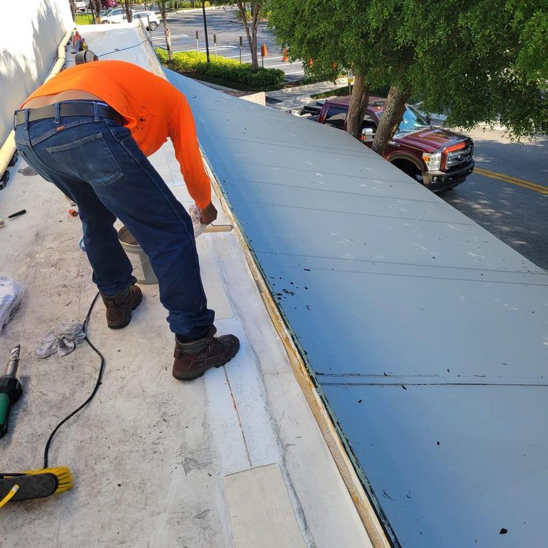 TPO roofing seam inspection on commercial building roof