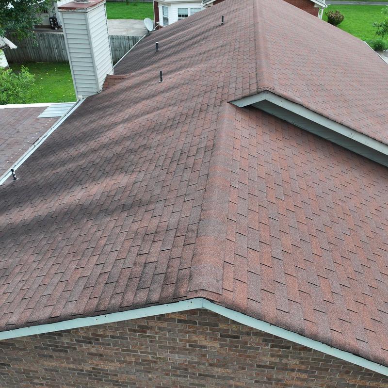 Asphalt shingle roof with hail damage inspection