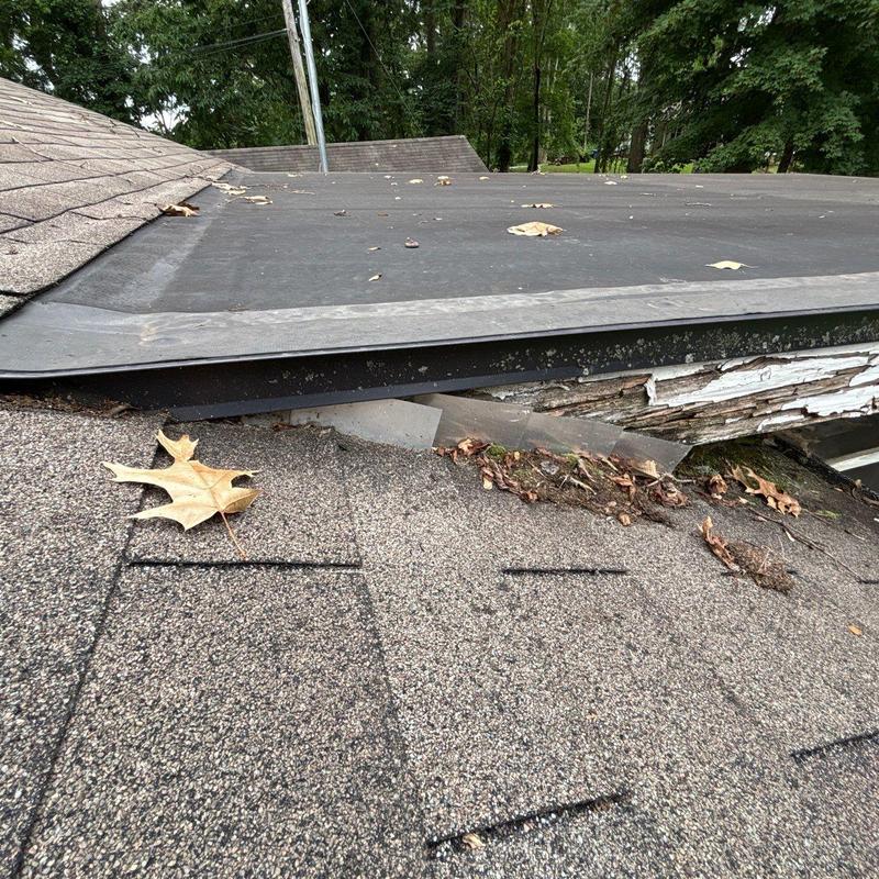 Roof shingles with wear and damaged flashing edge