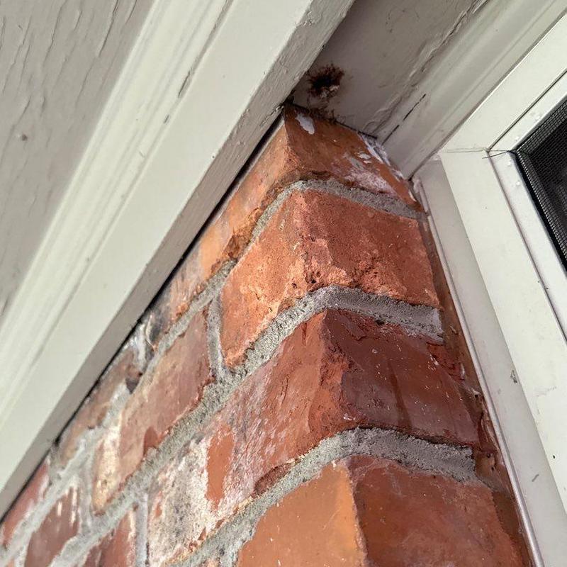 Brick corner mortar joint with weathering and gaps