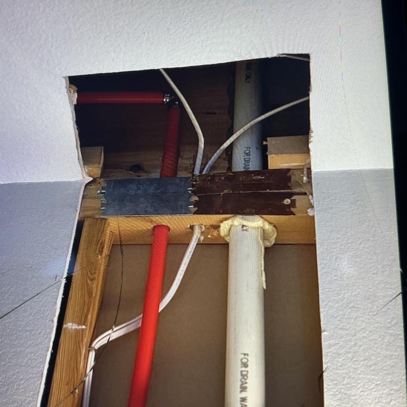 Copper water line rerouted above ceiling to lavatory sink Copper water line rerouted above ceiling to lavatory sink