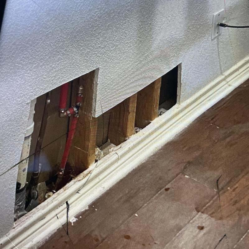 Copper water line behind wall with exposed studs Copper water line behind wall with exposed studs