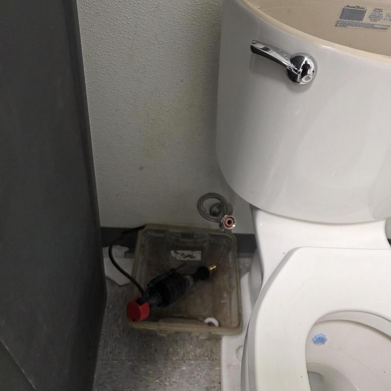 Toilet fill valve replacement parts near commercial toilet bowl