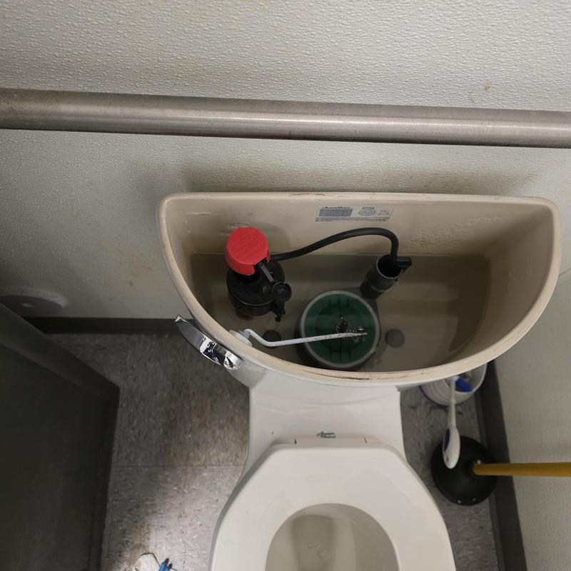 Toilet fill valve inside commercial toilet tank