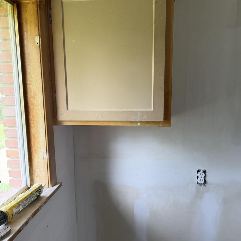 Bathroom vanity Sheetrock wall and outlet repair