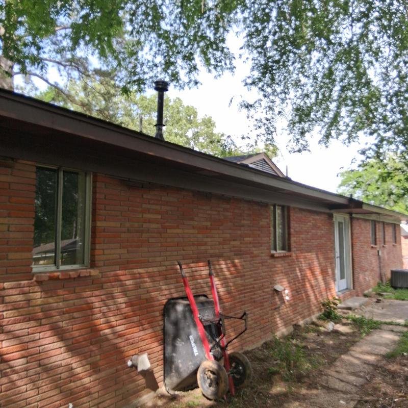 Fascia board and soffit on brick house exterior