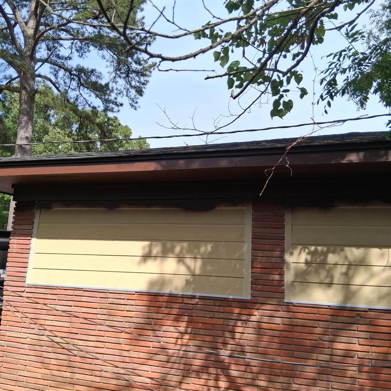 Fascia board and soffit painting on house exterior