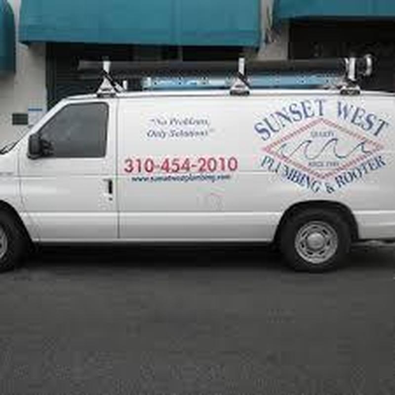 Plumbing and roofing service van with ladder rack