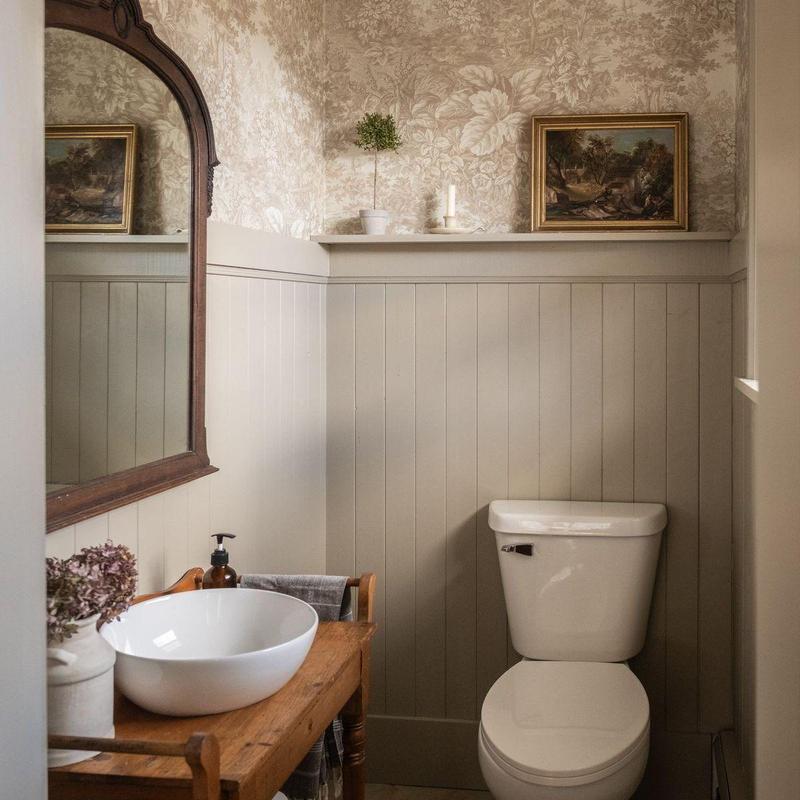 Toilet and sink in vintage-style bathroom interior
